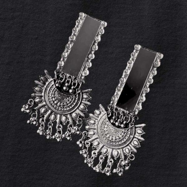 Oxidised Mirror Chaand Bali, Oxidised silver earrings with rectangular mirror tops and intricate circular sunburst design featuring hanging danglers on black fabric background