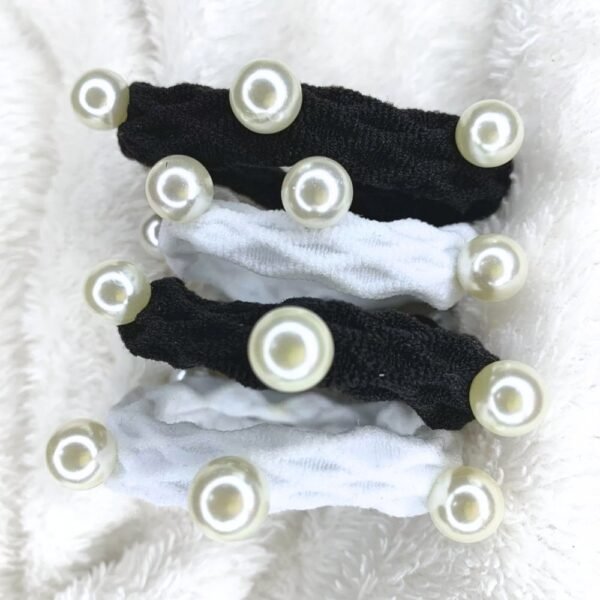 Pearl Hair Tie Set of 4, Set of four fabric hair ties in black and white, each decorated with round faux pearls, displayed on a soft white surface.