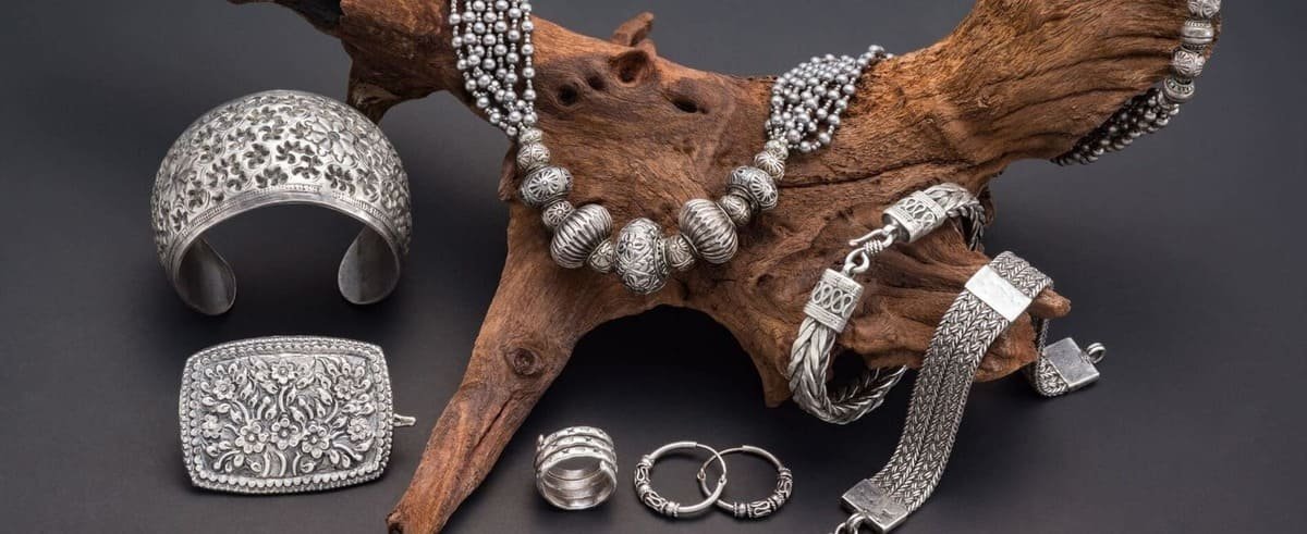 Brass Jewellery: The Alluringly Affordable Adornment | Avvni The Store oxidised jewellery on wood, necklace, kada, bracelets, rings, earrings banner, Which Colours Perfectly Complement Oxidised Jewellery