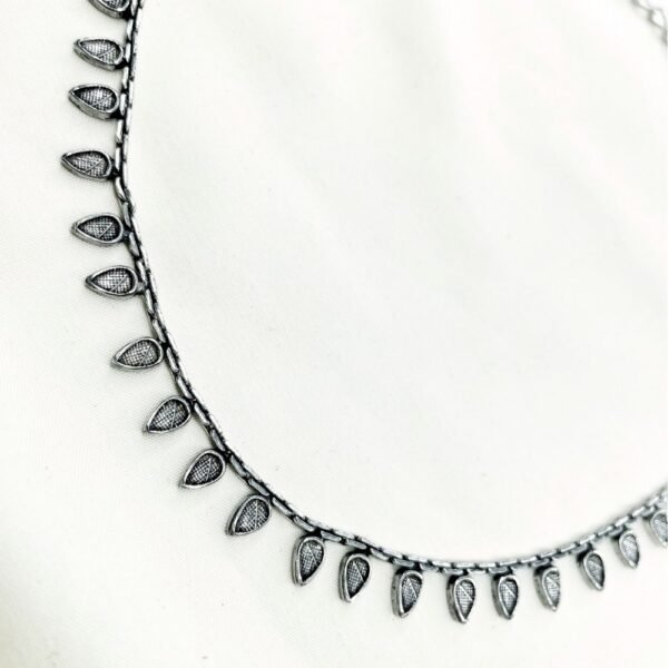 close up of oxidised teardrop minimal choker necklace, oxidised choker, minimal choker necklace. oxidised jewellery