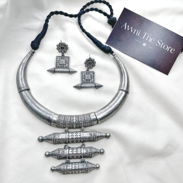 Long Oxidised Hasli Set, Tribal oxidised silver replica Hasli necklace set with engraved cylindrical pendants and matching ethnic earrings by Avni The Store