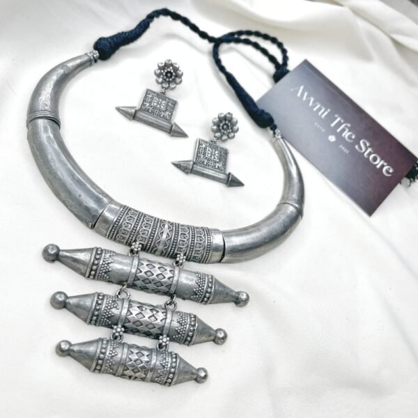 Long Oxidised Hasli Set, Tribal oxidised silver replica Hasli necklace set with engraved cylindrical pendants and matching ethnic earrings by Avni The Store