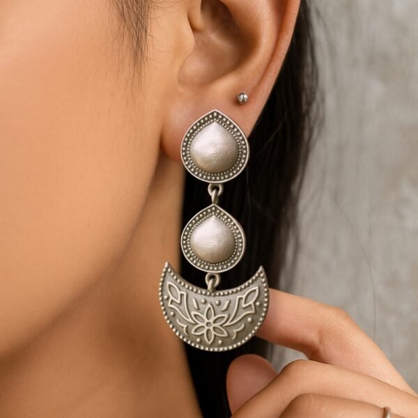 Model wearing Moonlit Bloom Jhumki — side profile showing dangle movement.