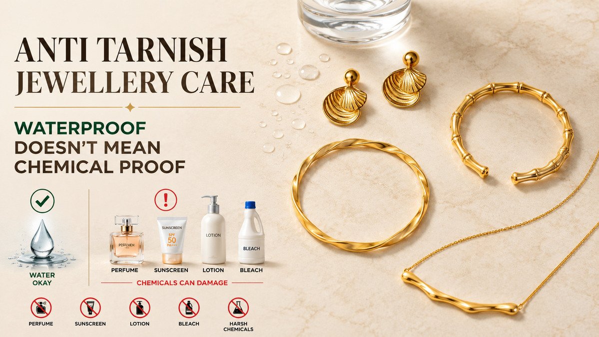 Gold anti tarnish jewellery care guide featuring shell earrings, a twisted bangle, and a wavy bar necklace on a marble background with water droplets, alongside perfume, sunscreen, lotion, and bleach to illustrate that waterproof jewellery is not chemical proof.