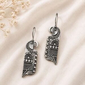 Close-up of detailed oxidised silver parrot earrings