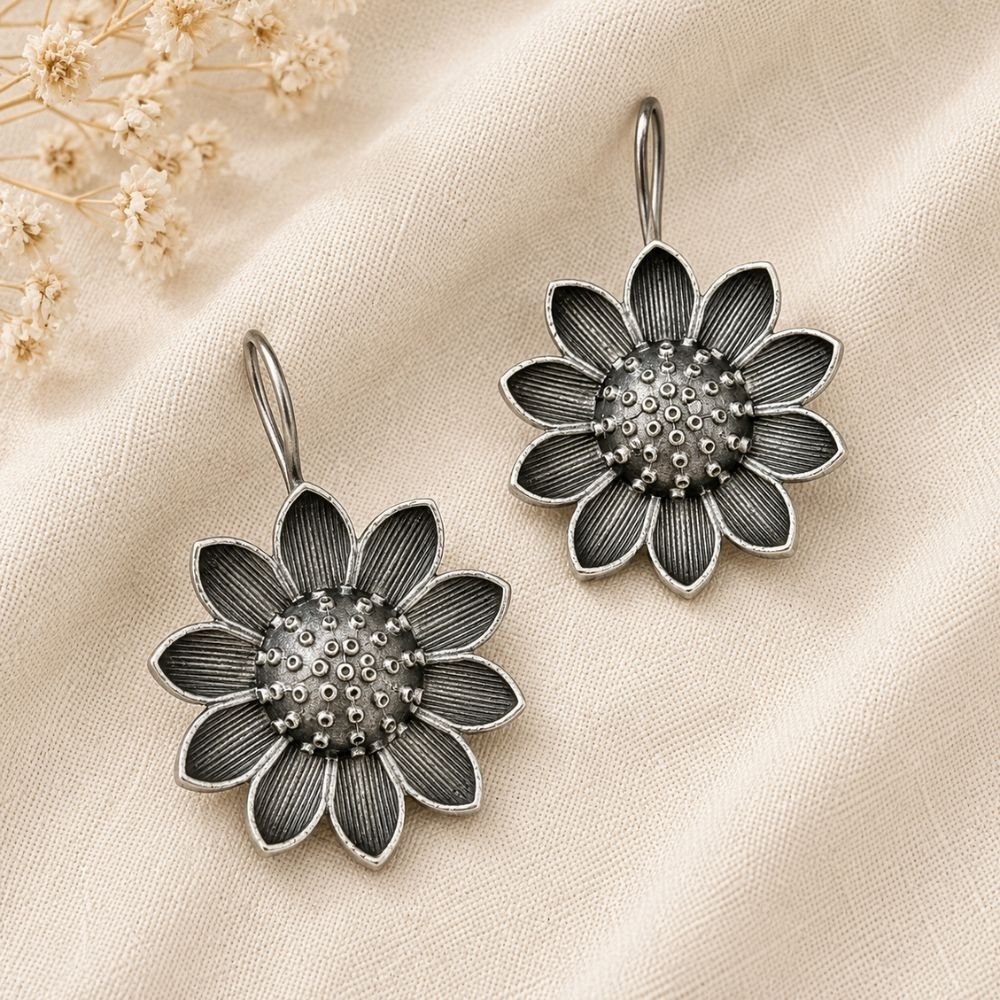 Avvni Oxidised Silver Sunflower Earrings | Avvni The Store Close-up of detailed oxidised silver sunflower earrings