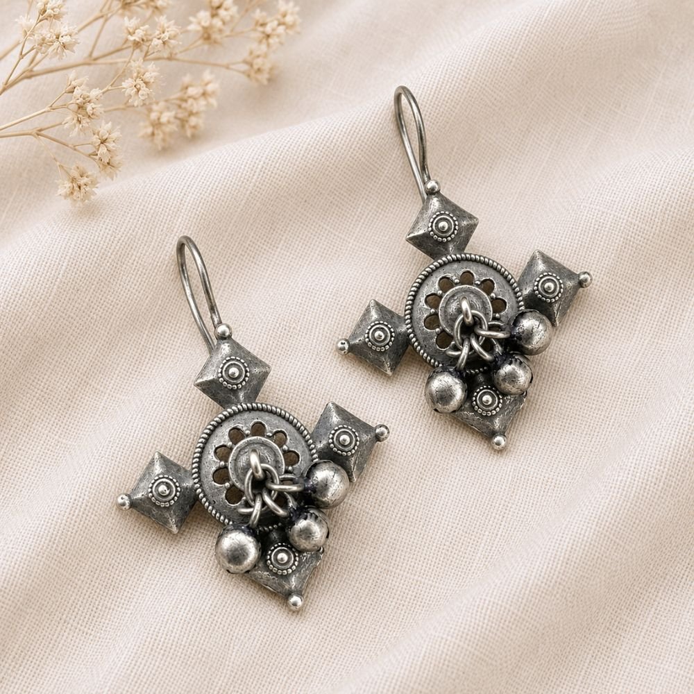 Avvni Oxidised Silver Tribal Drop Earrings | Avvni The Store Close-up of detailed oxidised silver tribal drop earrings