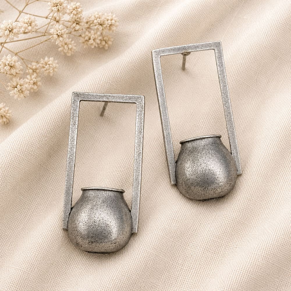 Avvni Oxidised Silver Tribal Pot Drop Earrings | Avvni The Store Close-up of detailed oxidised silver tribal pot drop earrings