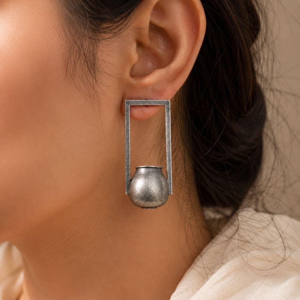 Avvni Oxidised Silver Tribal Pot Drop Earrings | Avvni The Store Model wearing Oxidised Silver Tribal Pot Drop Earrings