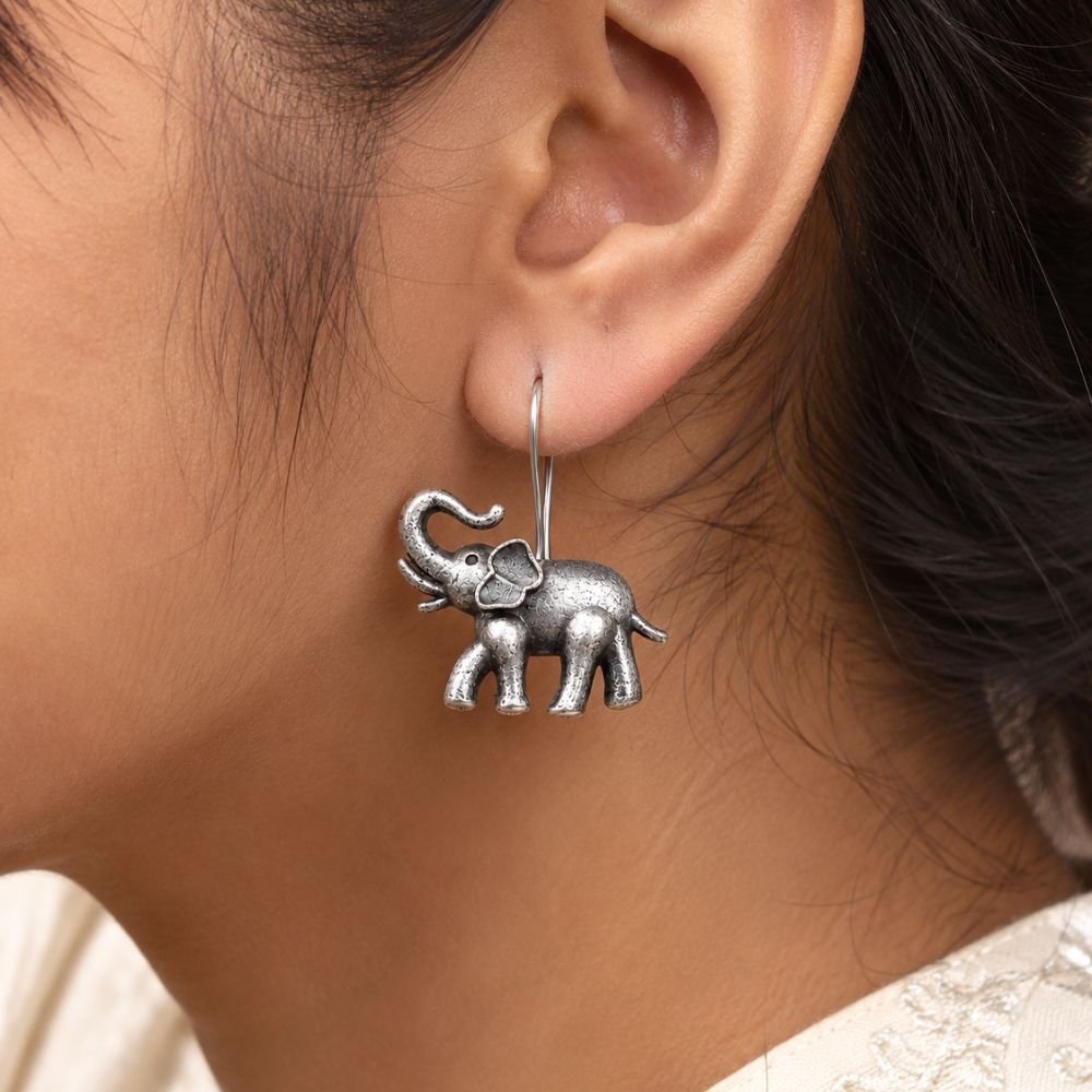 Avvni Oxidised Silver Elephant Drop Earrings | Avvni The Store Model wearing oxidised silver elephant drop earrings