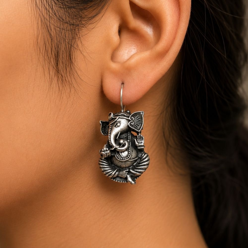 Avvni Oxidised Silver Ganesha Drop Earrings | Avvni The Store Woman wearing Oxidised Silver Ganesha Drop Earrings