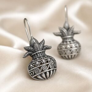 Close-up of Oxidised Silver Kalash Earrings with intricate mango leaf detailing