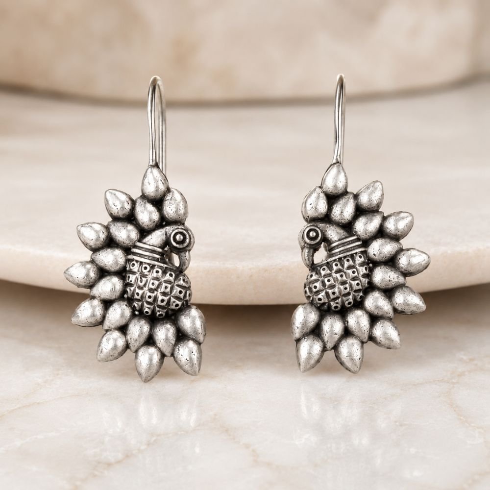 Avvni Oxidised Silver Peacock Drop Earrings | Avvni The Store Oxidised Silver Peacock Drop Earrings with intricate peacock design by Avvni The Store