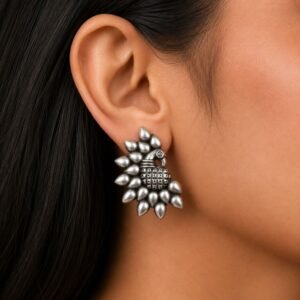 Close-up of Woman wearing Oxidised Silver Peacock Stud Earrings