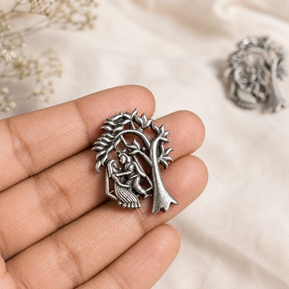 Avvni Oxidised Silver Radha Krishna Stud Earrings | Avvni The Store Close-up of Oxidised Silver Radha Krishna Stud Earrings with intricate detailing